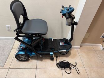 EV Rider Transport Automatic Folding Scooter in Blue Works great! Has two new batteries