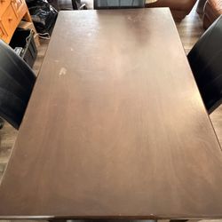Brown dinning room table + 4 black chairs - Estate Sale