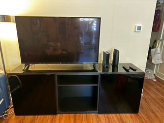 Large glass top and doors black entertainment center
