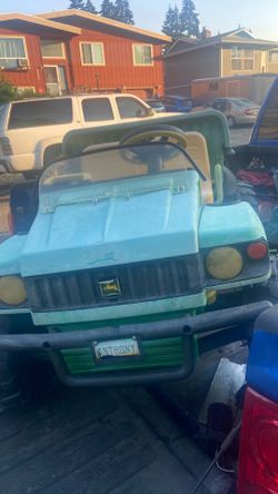 John deer power wheel come with battery and Charger price 60$ pick up. E. Side Tacoma
