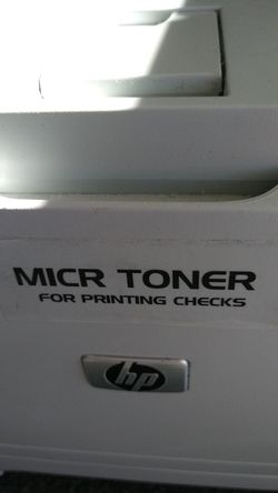 Laser printer with magnetic toner for printing checks