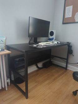 Black desk with shelf under