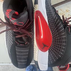 Nike Air Jordan Jumpman 2021 basketball shoes in the "Bred" (black and red) colorway.