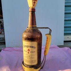 Seagrams 7 antique bottle with handle pourer.