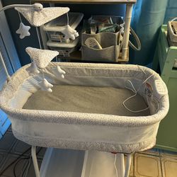 Delta Children Smart Sleep Autoglide Bluetooth Bassinet 