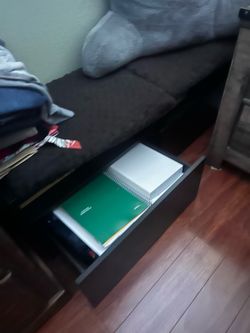 Tv stand that can either be hang to the wall or set on the floor.  It can also be use as a bench. It has two drawers.