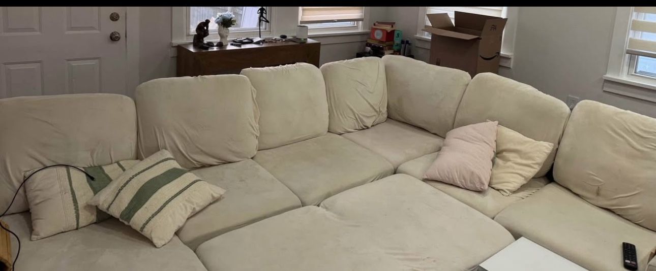 Gray  Modular Sectional With Pull Put Bed And Beige Covers