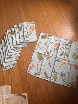 13 Blue floral print cotton napkins with small cord binding