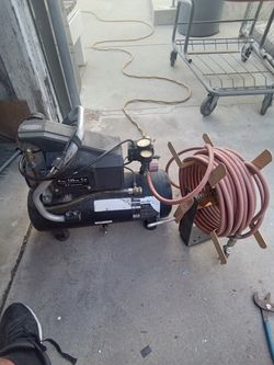 Air Compressor With Hose and Wall mount for  the Hose works Good  50 of Hose and Two Attachments