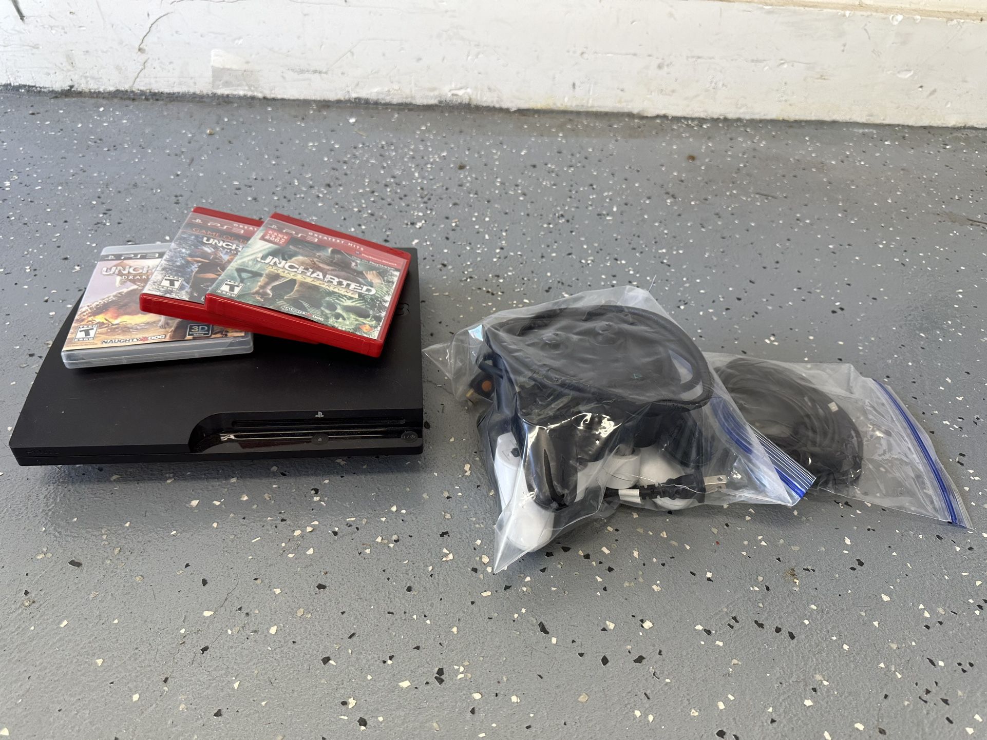 PS3 with 4 Controllers, 3 Uncharted Games, and Cables