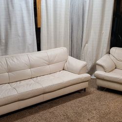 Ashley Furniture Gunter - Brilliant White Sofa and matching leather chair in good condition. Awesome matching set