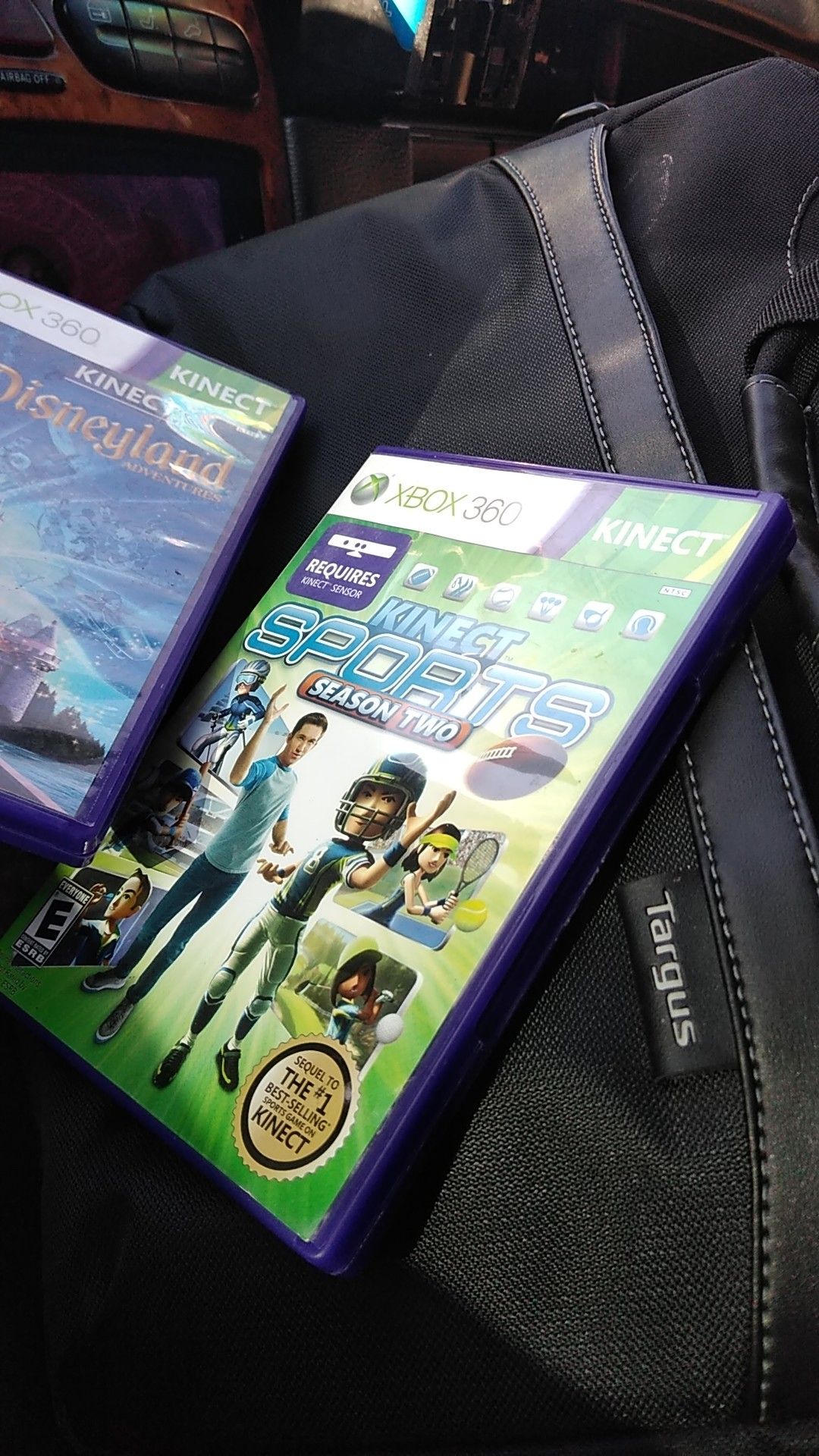 Two Xbox games and a laptop case