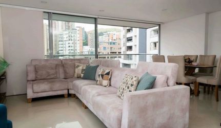 Light Pink Sectional Sofa with Throw Pillows