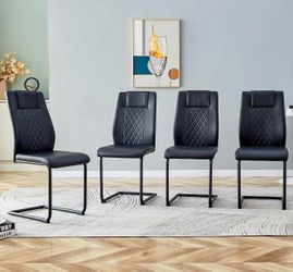 Set of 4 New in Box (Never opened) Modern Chairs with PU Faux Leather Padded Seat and Metal Legs.