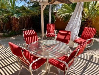 Vintage Tropitone patio dining set with classic Palm Springs resort style and timeless Mid-Century outdoor design.