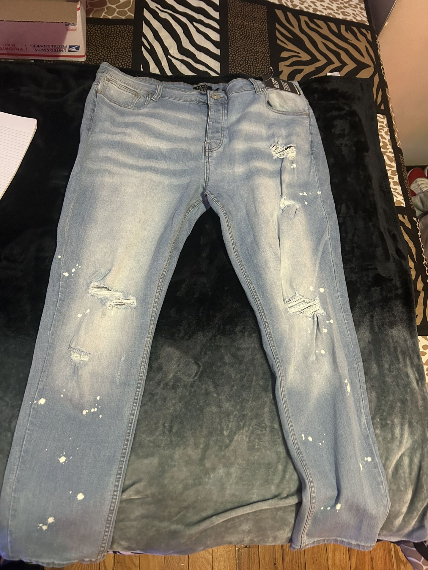 Plus skinny all over ripped bleached paint splatter jeans Size 42