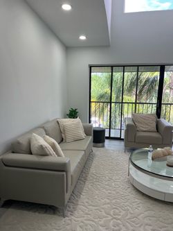 Grey leather couch and love seat
