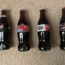 DENVER BRONCOS COMMEMORATIVE COCA-COLA BOTTLES—4 DIFFERENT