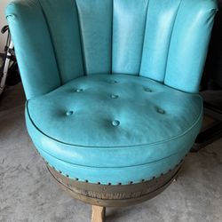 Leather swiveling barrel chair