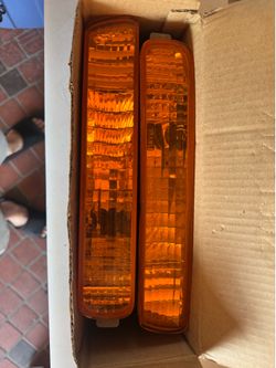 1994 to 1995 Honda Accord four-door sedan front bumper turn signal light assemblies OEM