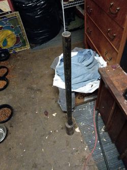 A post driver wooden fence post rod metal post