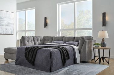 New Gray sleeper sectional special by Ashley Furniture