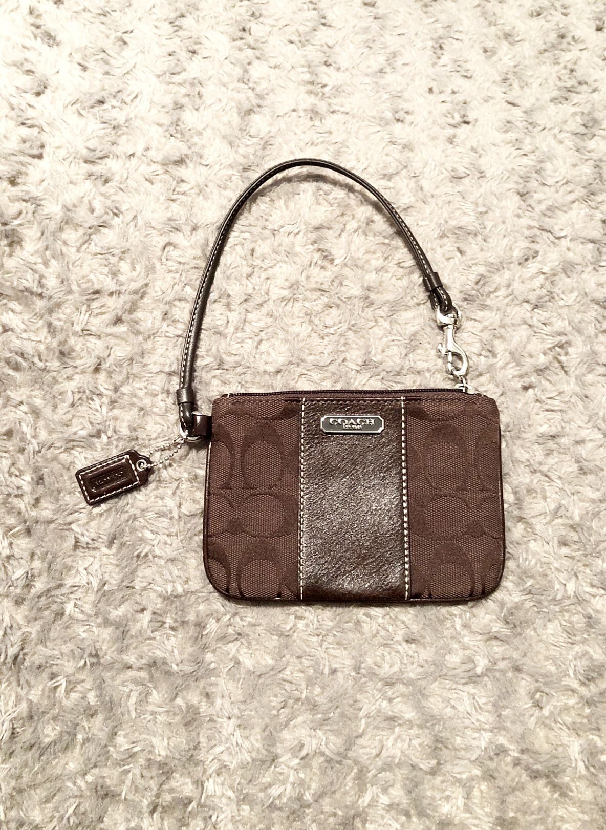 Coach monogram wristlet paid $80 great condition. Plum lining with keytag.