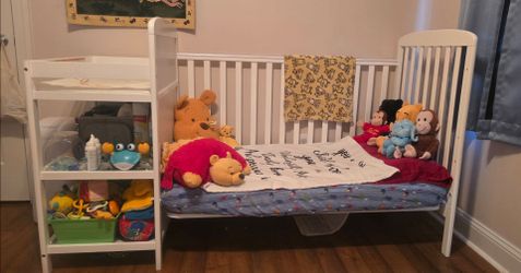 3-in-1 crib with changing station, changing pad, and crib mattress