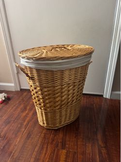 Hand-woven wicker laundry basket    H 20 inch , oval is 18x13 inches
