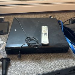 DVD Player, 50 Movies, And Movie Racks 