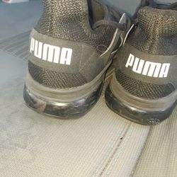 All black Pumas mens 10