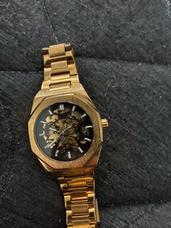 Gold open face watch