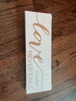 Brand new Love Never Fails Wood Sign