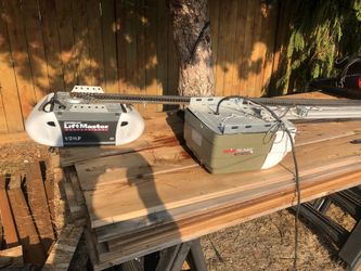 2 Garage Door Openers  1 Genie 1 Liftmaster