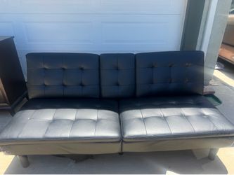 Futon turns into nice couch with cup holders