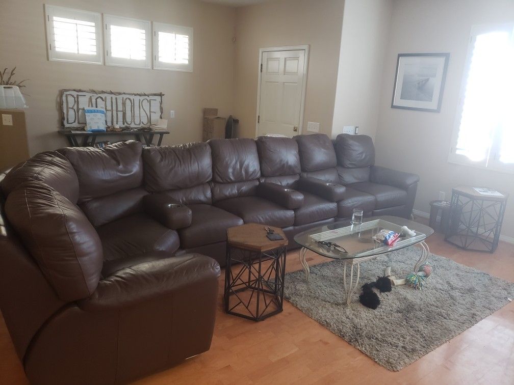 Large sectional couch with movable cup holders. Free if picked up today