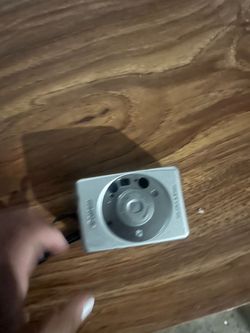 silver Canon Elph LT 260 point-and-shoot camera.