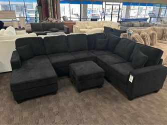 Stunning new black sectional and ottoman