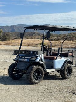 Metallic sky blue golf cart 4 seater.