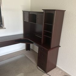 Almost brand new L-shaped corner desk with hutch with cherry/mahogany laminate finish