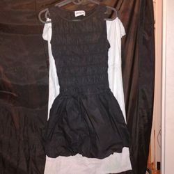 Selling a Princess Polly Sz, 2 "Demure Shirred Mini Dress" in Black