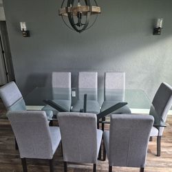 Glass dining room table w/8 chairs