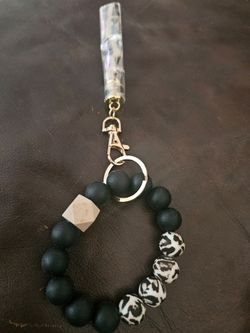 Miscellaneous items: key chains, stuffing, coin purse, and crochet coin purse.