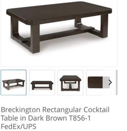 BRAND NEW COFFEE TABLE BY ASHLEY DESIGN