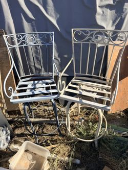 Pair Of Wrought Iron Chairs