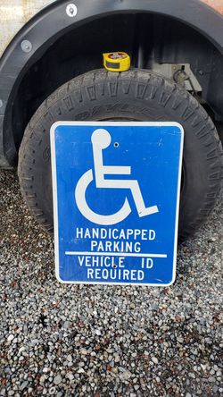 Street sign handicapped parking only.