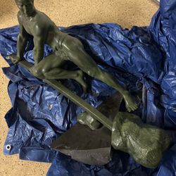 Man Lifting A Rock -Bronze Sculpture With Green Patina