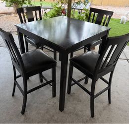 Black table with 4 chairs