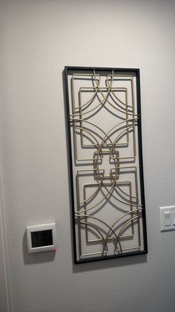 Gold and Black Metal Wall Art
