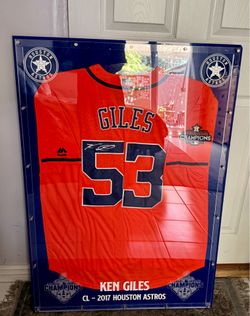 A framed autographed Ken Giles #53 Houston Astros orange alternate jersey with the 2017 World Series Champions patch